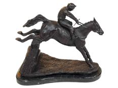 Bronze steeplechase jockey sculpture on a marble plinth, 33cm.