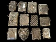 Collection of twelve silver vesta cases all with embossed or engraved decoration.