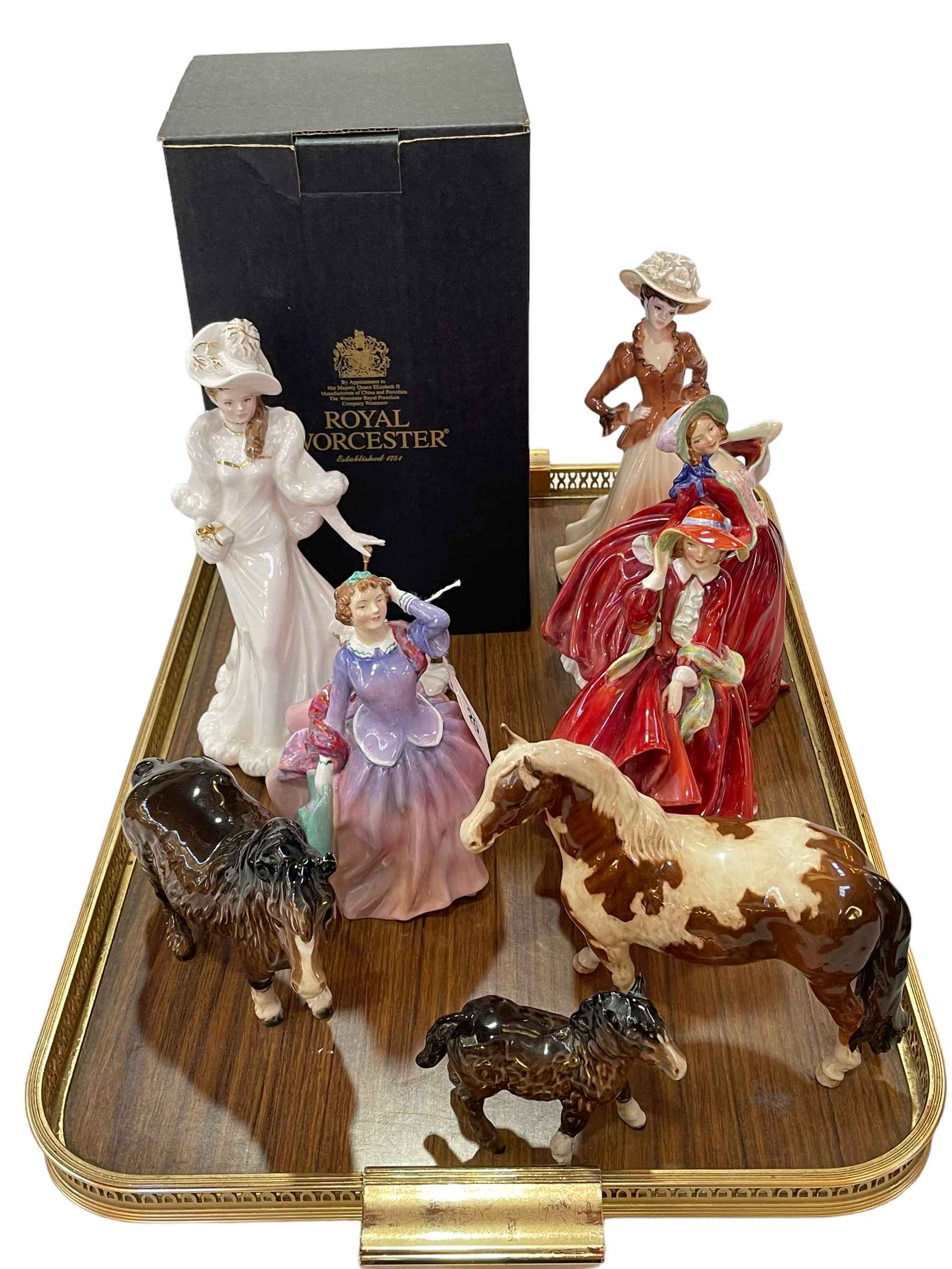 Three Royal Doulton ladies, Royal Worcester 'Eleanor', Coalport 'Joan', and three Beswick ponies.