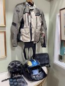 Collection of motorcycle clothing including jacket, trousers, helmets, etc.