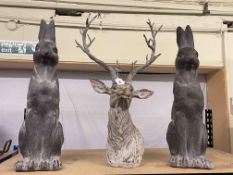 Three composite sculptures including pair of hares and stags head.