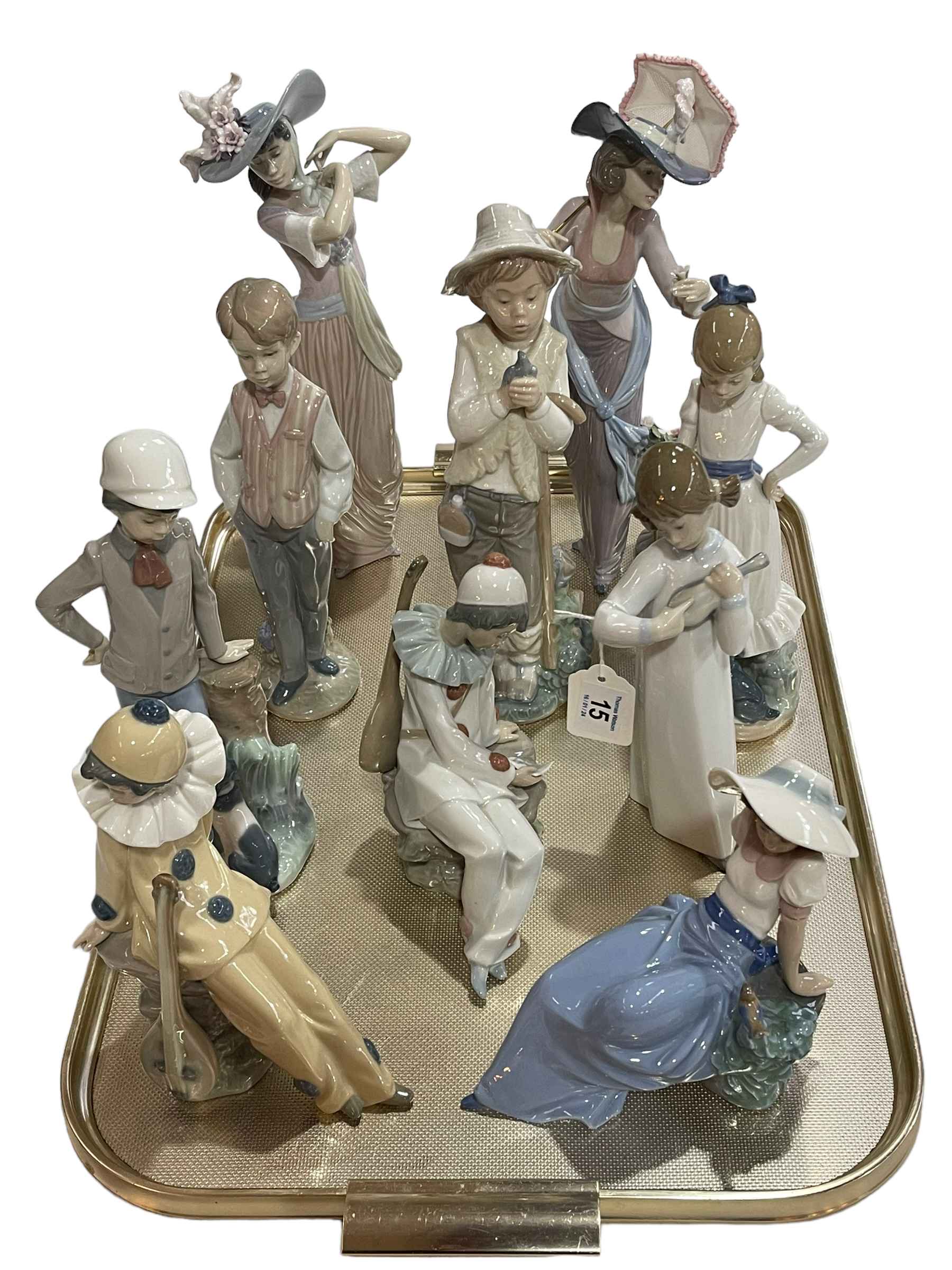 Four Lladro and six Nao figurines.