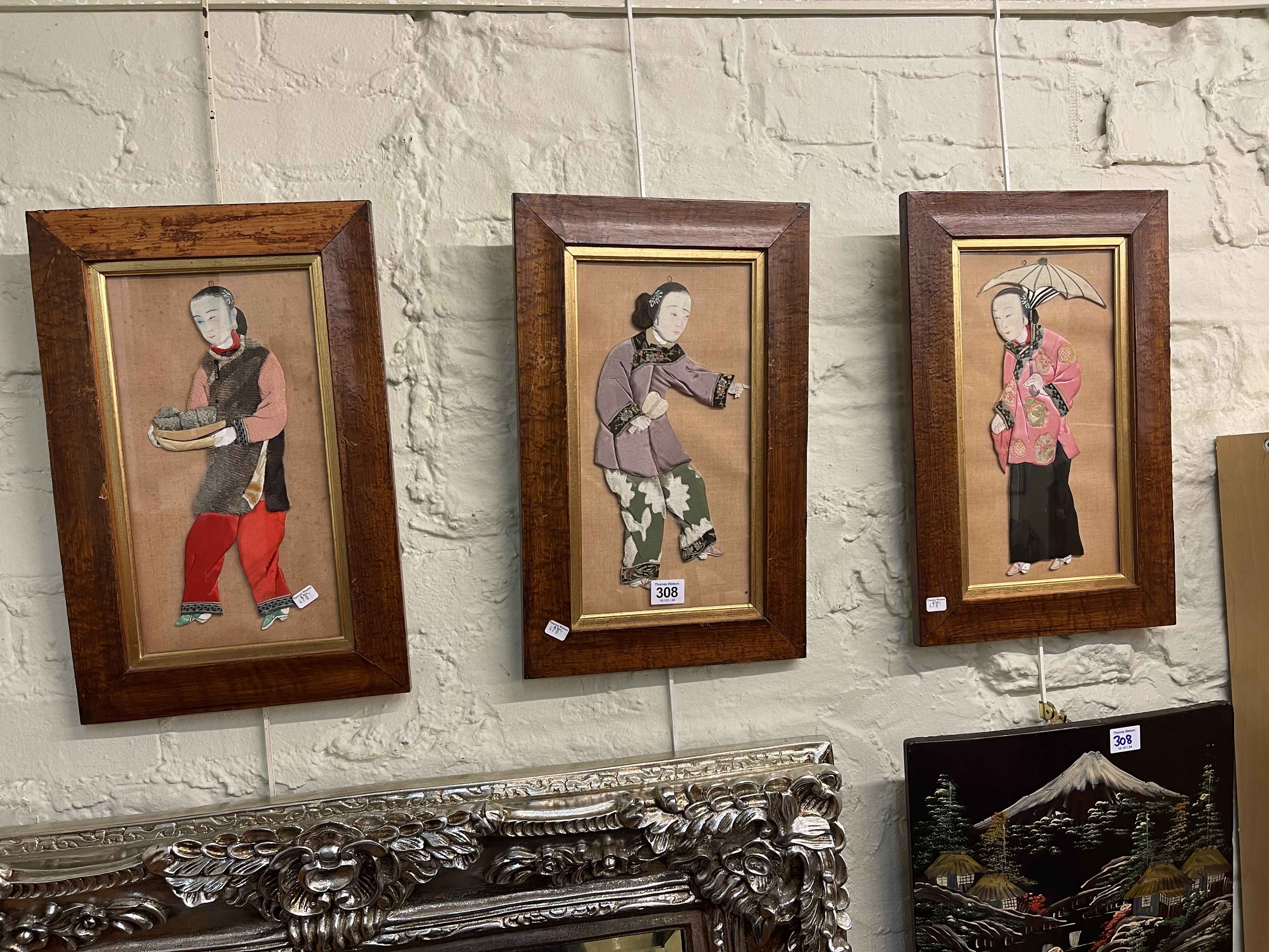 Japanese lacquered and bone plaque, 54cm by 33cm, and three fabric Geisha pictures (4).