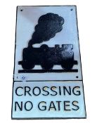 Cast metal 'Crossing No Gates' railway sign.