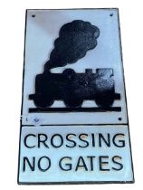 Cast metal 'Crossing No Gates' railway sign.