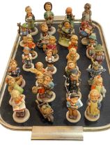Collection of twenty eight Hummel figures.