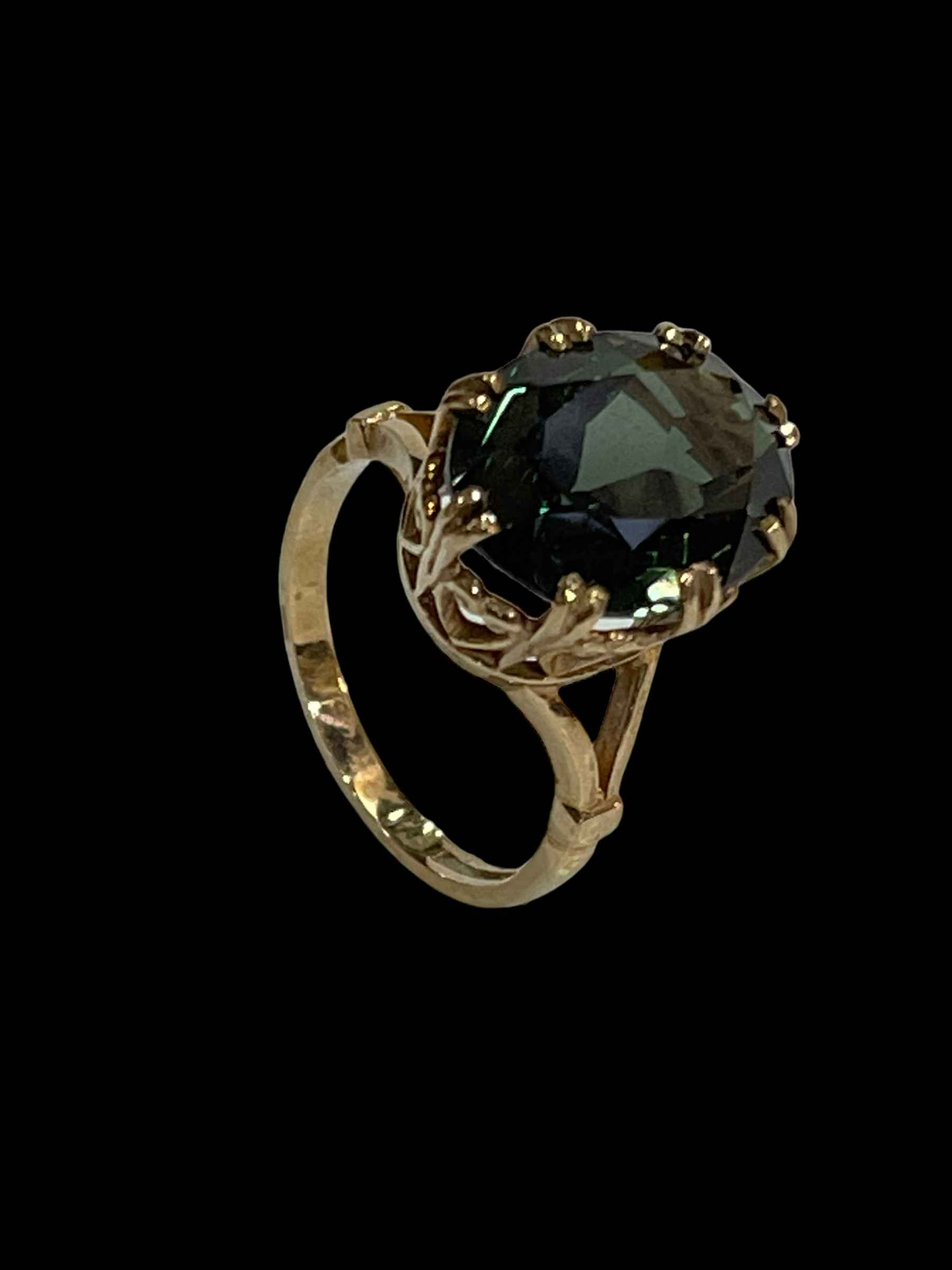 Green gemstone and 9 carat gold ring, size Q.