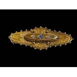 15 carat gold die-stamped brooch set with sapphire and diamond, 4.25cm across.