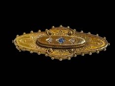 15 carat gold die-stamped brooch set with sapphire and diamond, 4.25cm across.