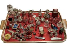 Tray of collectables including napkin rings, salt spoons, silver and mother of pearl penknife,