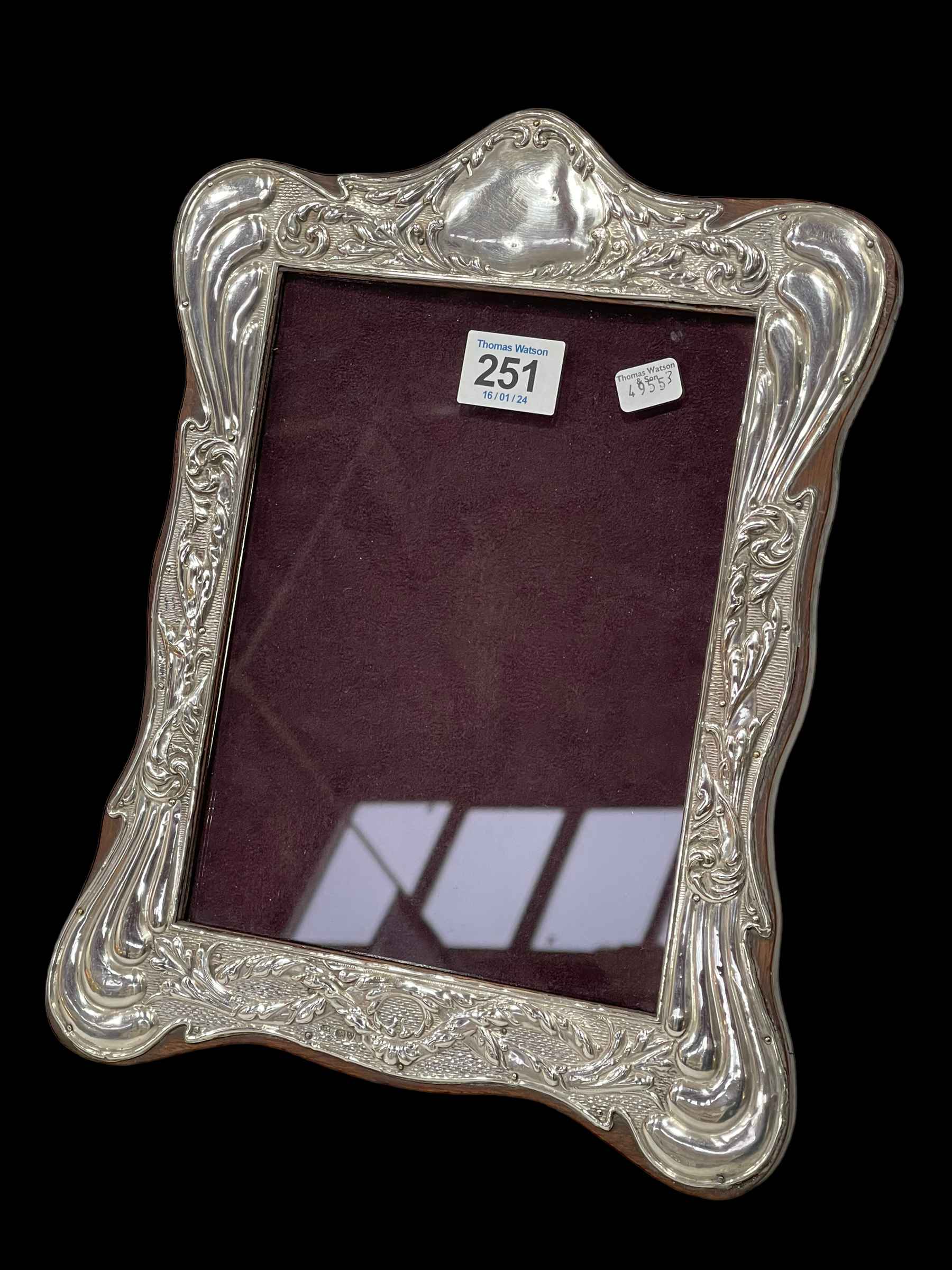 Chester hallmarked silver easel photograph frame in Art Nouveau taste, 1912, 31cm by 23cm.