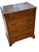 Mahogany fold top Bachelors chest of four graduated drawers on bracket feet,
