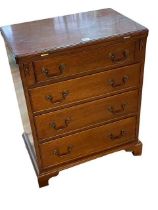 Mahogany fold top Bachelors chest of four graduated drawers on bracket feet,