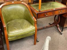 Green leather occasional armchair and mahogany two drawer sofa table (2).