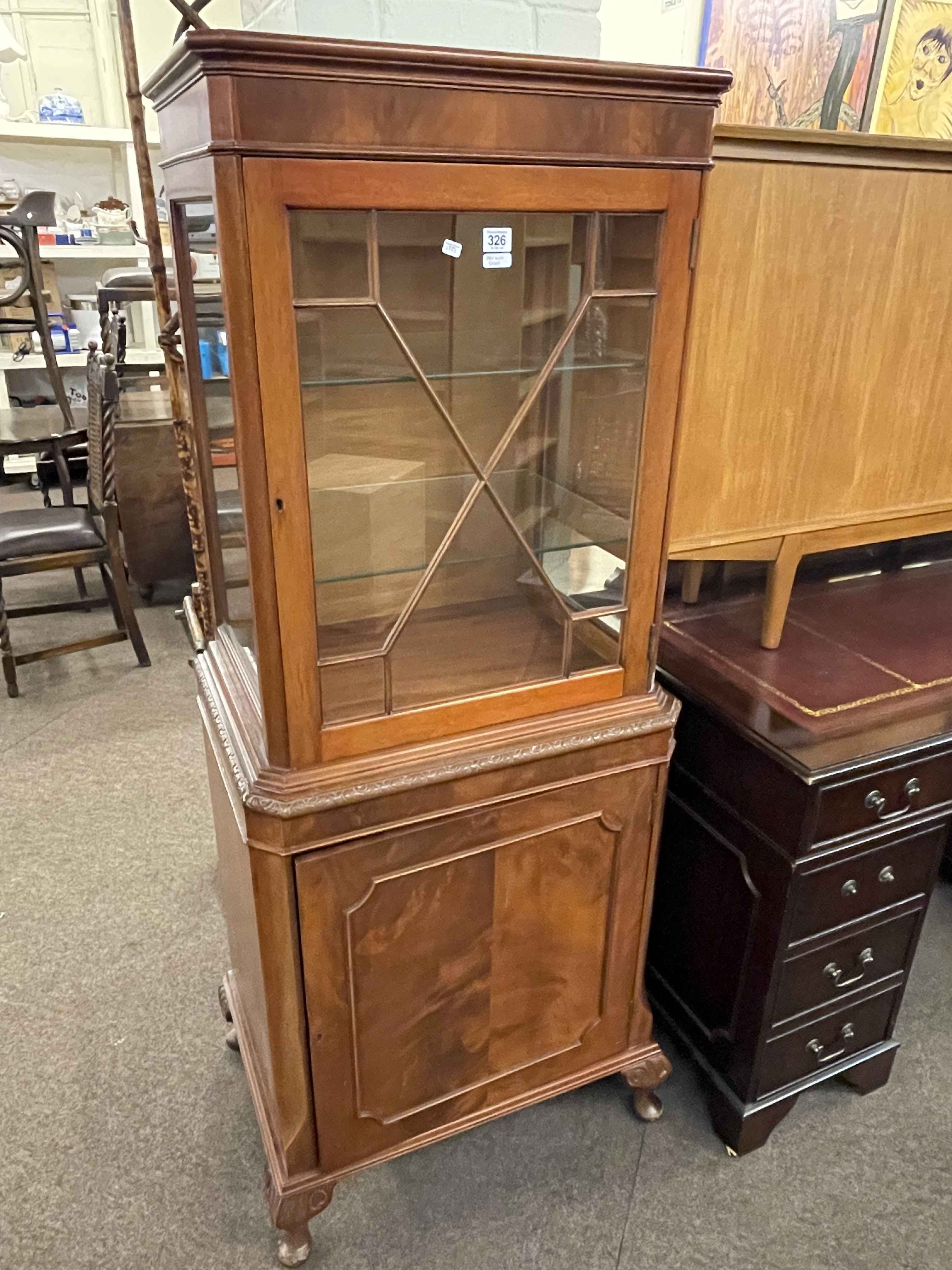 Mahogany cabinet having single astragal glazed door above a cupboard door on cabriole legs,