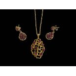 9 carat gold gem set pendant and chain and similar pair of earrings.