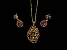 9 carat gold gem set pendant and chain and similar pair of earrings.