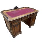 Continental carved desk having three frieze drawers above two carved panel doors enclosing six