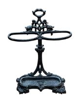 Cast iron two division stick stand, 73cm by 51cm.