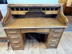 Early 20th Century oak double pedestal roll top desk, 113cm by 127cm by 76cm.