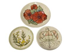 Three Moorcroft plates.