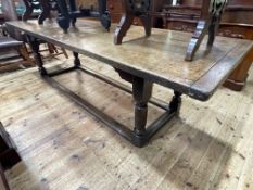 Antique oak refectory table on turned legs joined by block stretchers, 73cm by 85cm by 236cm.