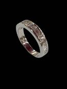 18 carat white gold and baguette cut diamond half eternity ring, size M.