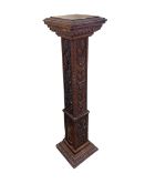 Leaf and figural carved oak pedestal, 120cm by 32cm by 32cm.