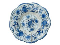 Delft blue and white lobed dish with peach decoration, 22cm diameter.