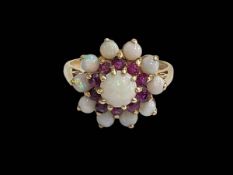 Opal and amethyst petal design ring set in 9 carat yellow gold, size R.