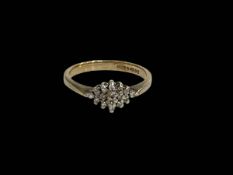 9 carat gold oval diamond cluster ring, size L.