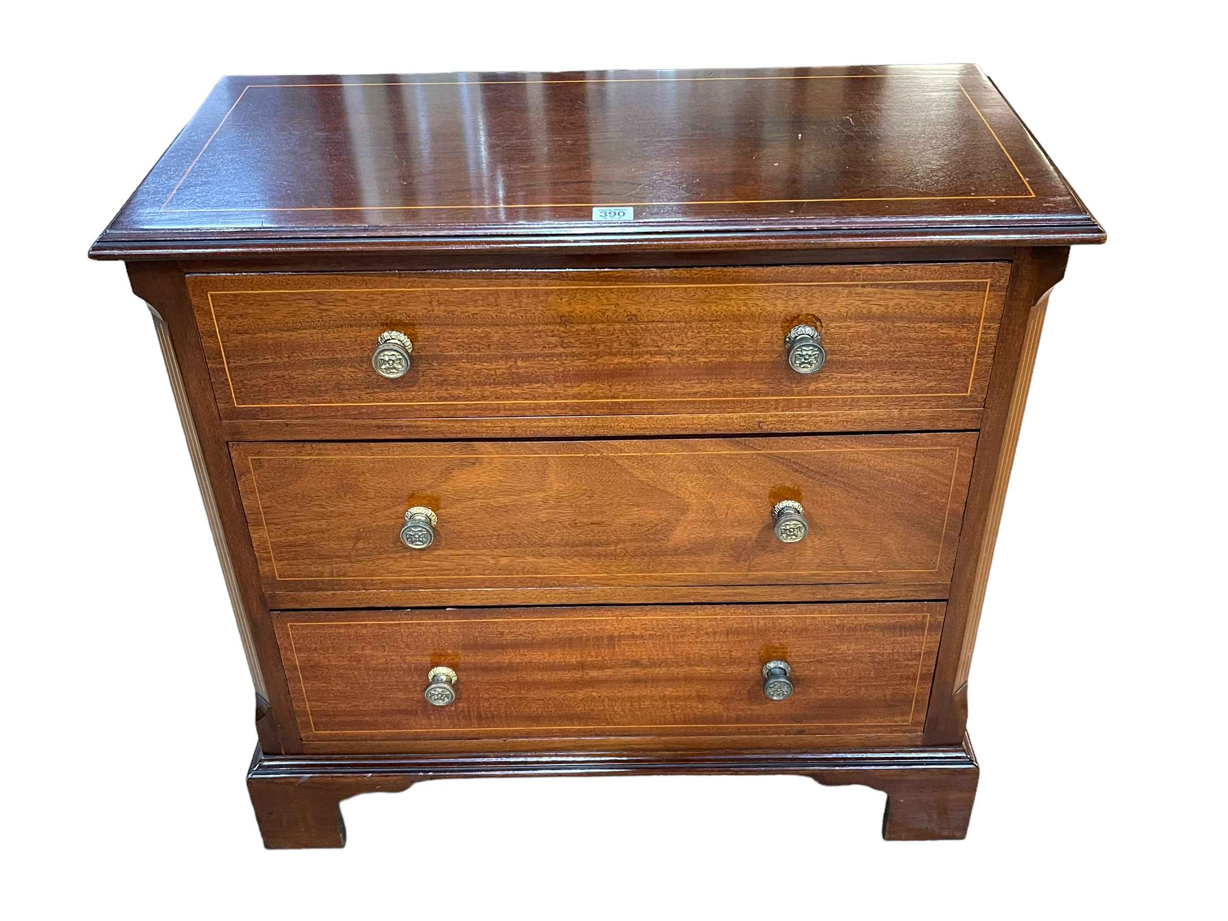 Polished mahogany and line inlaid chest of three long drawers on bracket feet, 75cm by 78cm by 37cm.