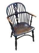 Antique yew and elm Windsor pierced splat back elbow chair with crinoline stretcher.