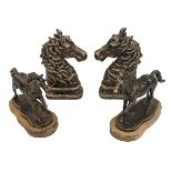 Pair of bronzed horses heads and pair of bronzed horses on wood plinths.