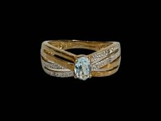 9 carat gold diamond and topaz ring, size M½.