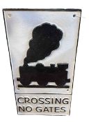 Cast metal 'Crossing No Gates' railway sign.