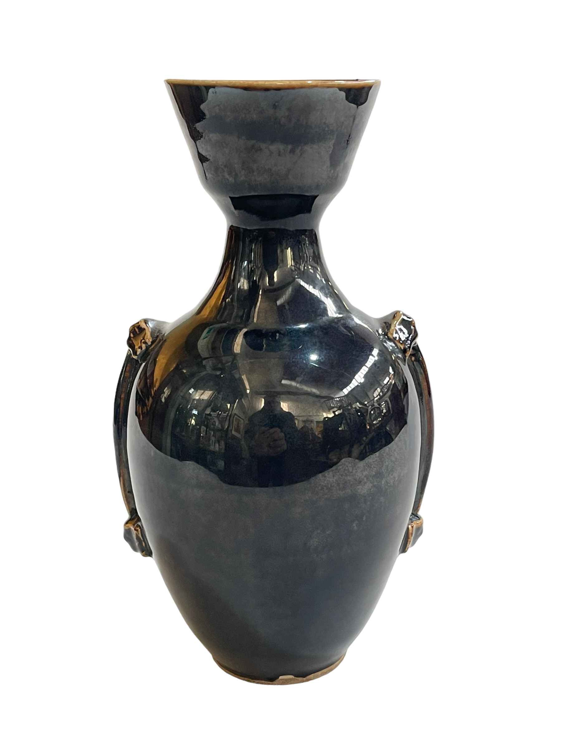 Oriental black glazed vase, 25cm high.