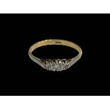 Three stone diamond 18 carat gold ring, size P.