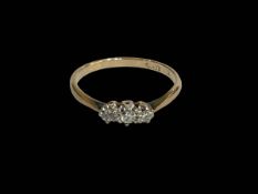 Three stone diamond 18 carat gold ring, size P.