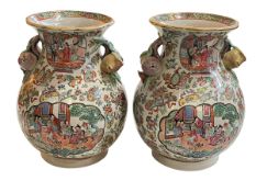 Pair of large Cantonese double handled vases decorated with figures, flowers and butterflies,