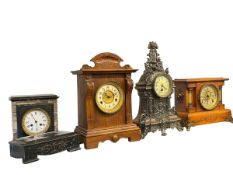 Four Victorian mantel clocks.