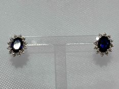 Pair of sapphire and diamond earrings, the central oval sapphires 2.