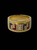 18 carat gold band ring set with diamonds, sapphires and rubies, size O.