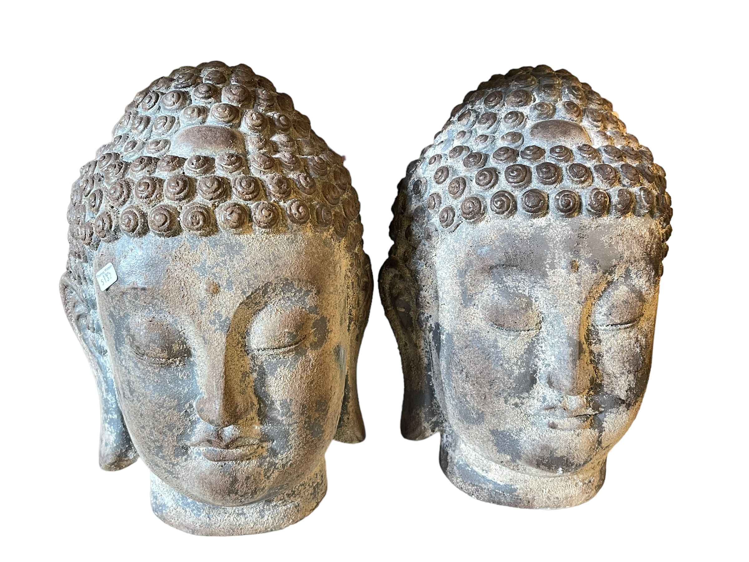 Two composite Buddha heads.