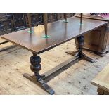 Oak refectory table raised on carved bulbous pillars, 75cm by 75cm by 165cm.