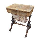 Victorian walnut sewing table having frieze drawer above a deep drawer raised on turned pillars,