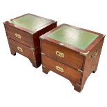 Pair Campaign style two drawer pedestals with leather inset tops, 44cm by 46.5cm by 38.5cm.