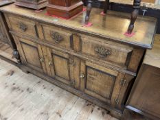 Period style oak dresser having three drawers above three fielded panel doors,