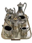 Silver plated four piece and three piece tea services and pair of sugar tongs.