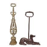 Ornate whippet and brass paw doorstops.